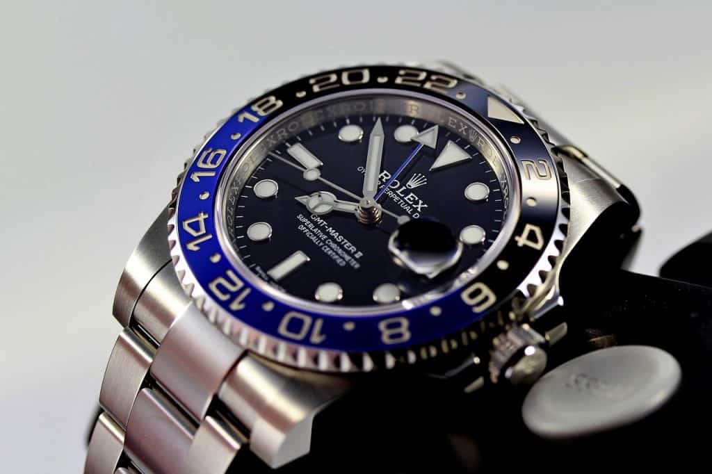 cllose up of a Rolex GMT submariner black and blue face watch