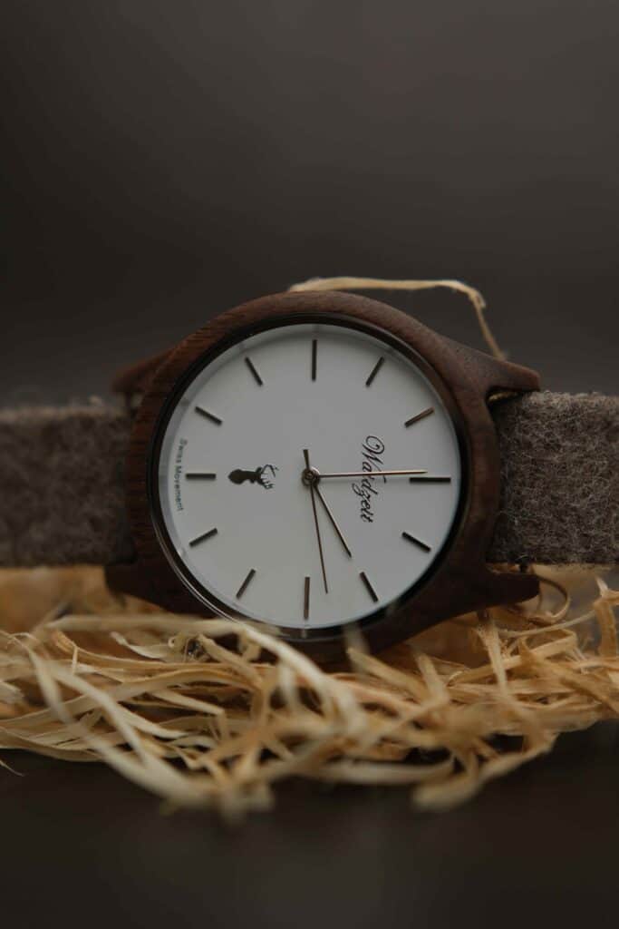 Close up of the Waidzeit watch on a bed of straw